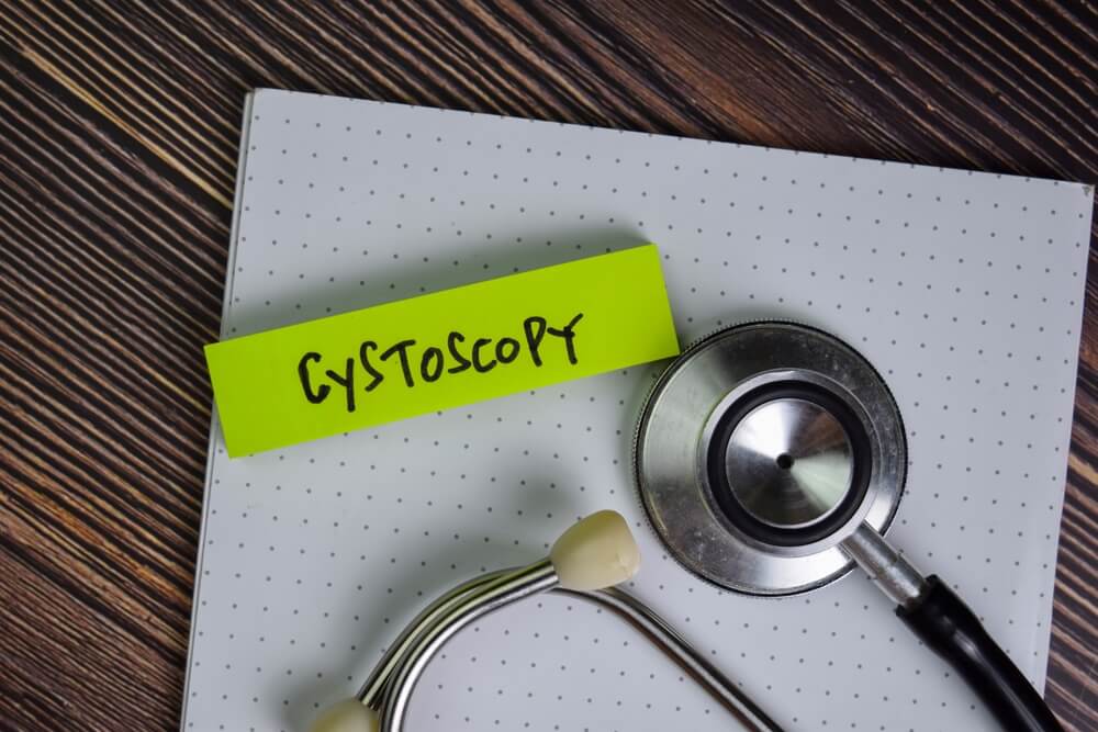 Cystoscopy Write on Sticky Notes Isolated on Wooden Table.