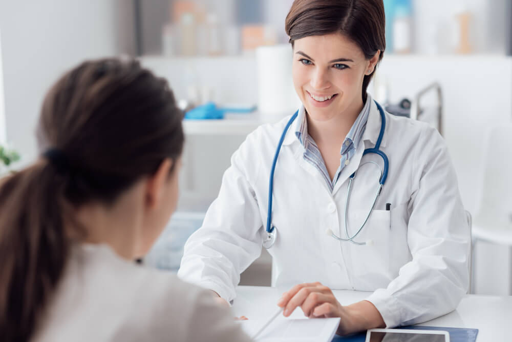 Female Doctor Giving a Consultation to a Patient and Explaining Medical Informations and Diagnosis