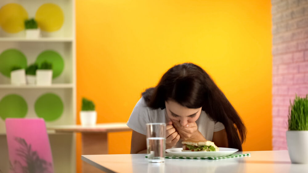 Female Feeling Nausea Sitting Canteen Table, Junk Meal Poisoning, Food Quality