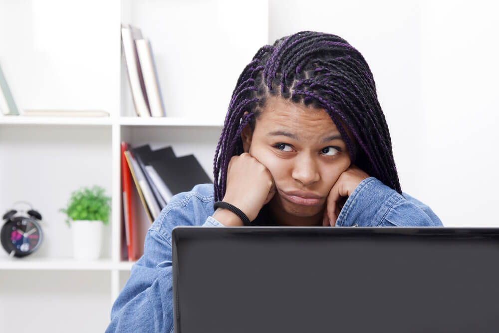 Female Bored and Tired With the Laptop