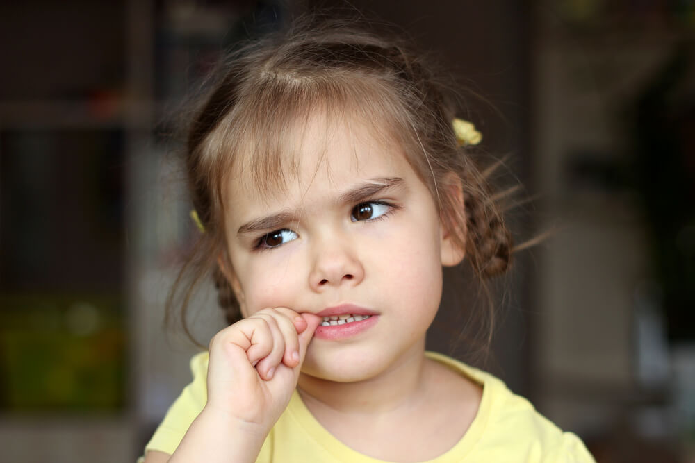 Beautiful Girl Nervously Biting Her Nails