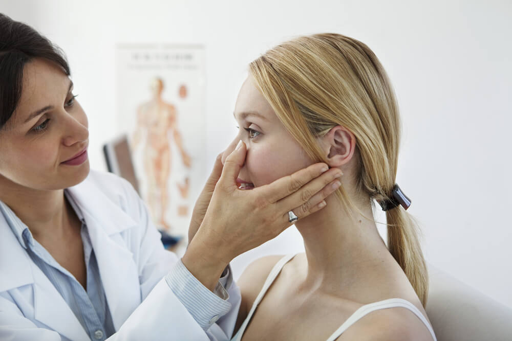 Woman at the Doctor’s Getting a Nose Exam
