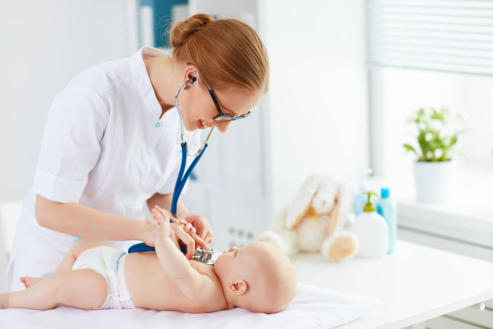 Doctor Pediatrician and Baby Patient in Clinic