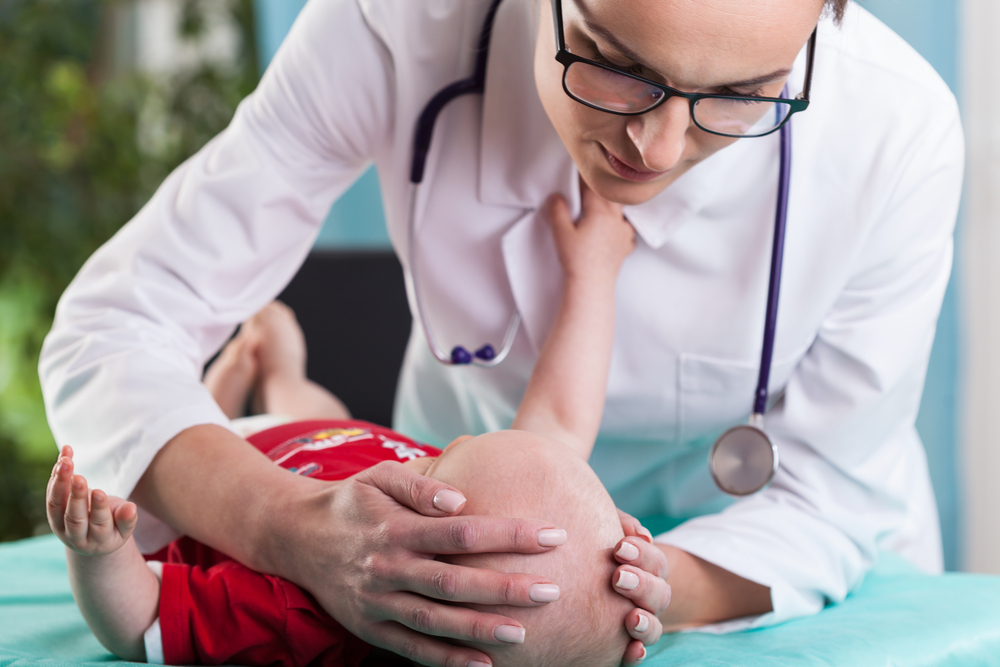 Image of Child’s Neurologist Diagnosing Little Boy