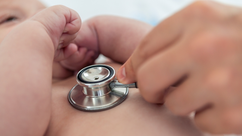 Doctor Listens the Heart to Small Newborn With Stethoscope