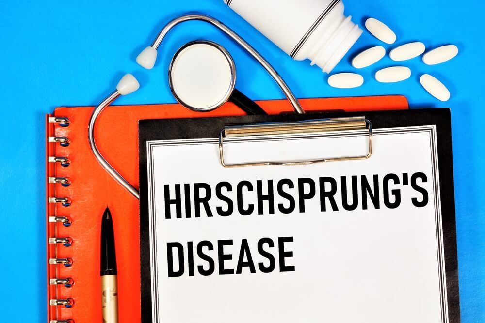 Hirschsprungs Disease An Inscription In A Folder With A Medical Diagnosis Against The Background Of A Stethoscope And Medications
